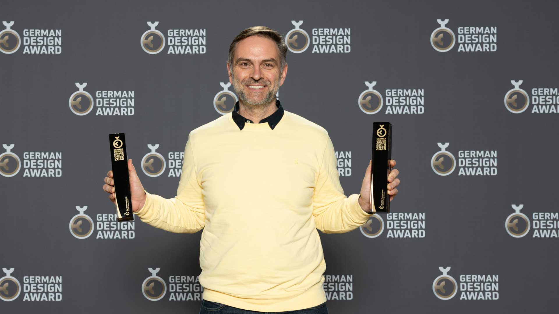 Andreas Diefenbach, Managing partner of PHOENIX holding two golden awards from the german design awards 2025
