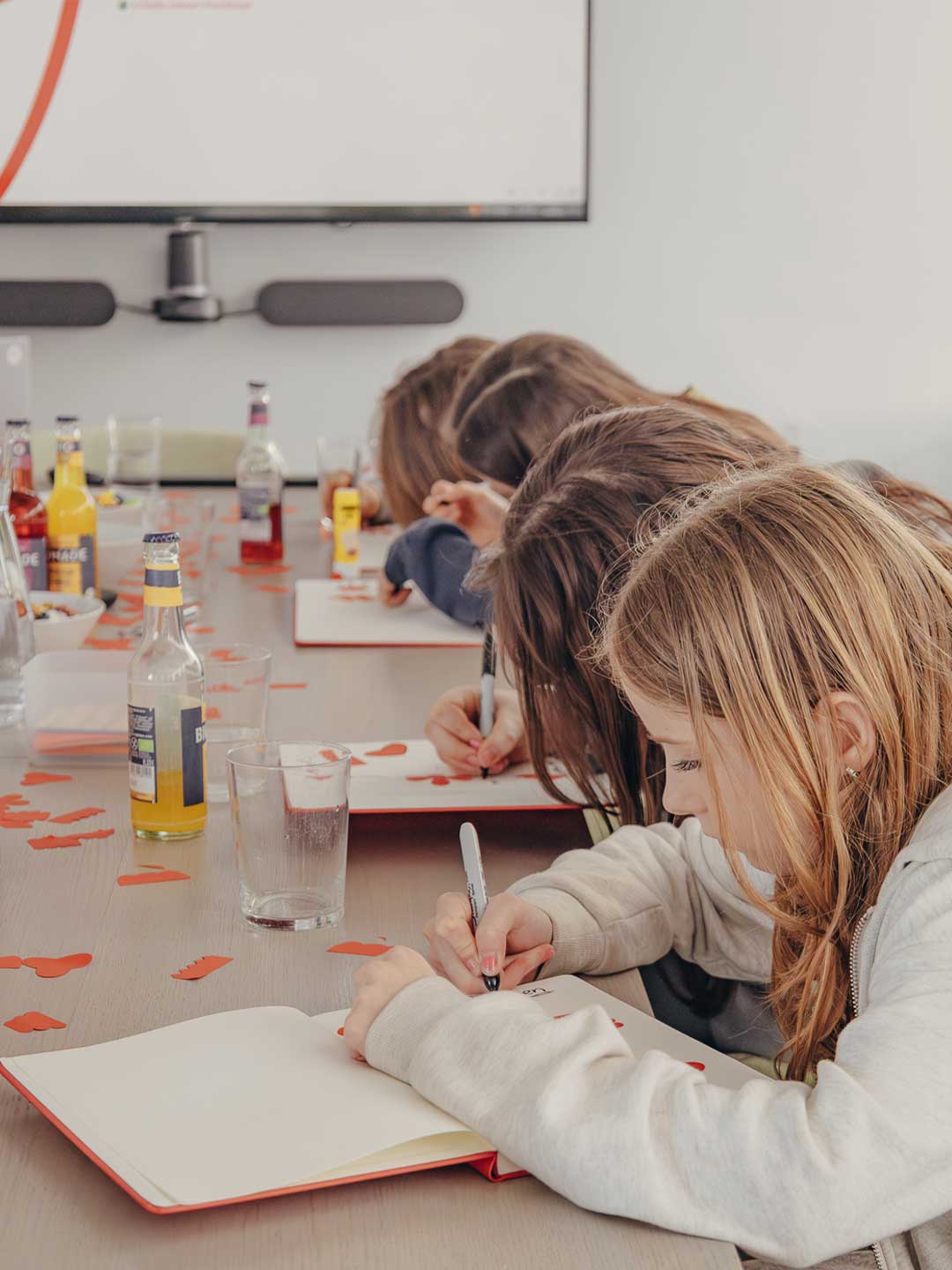 Girls experimenting with ideas and prototypes in a dynamic design studio environment