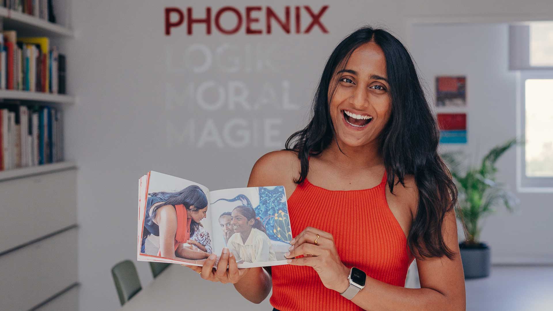 Aditi Surana, shows the Yoyo book, open on the page of the beyond play workshop in india