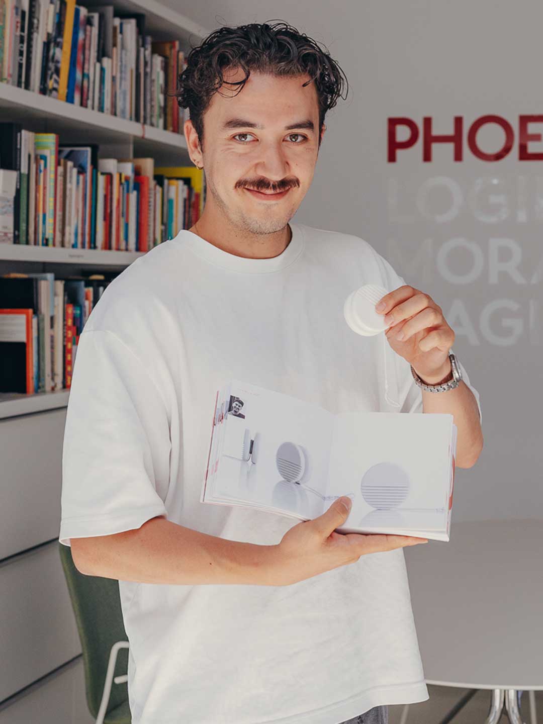 Timo Miura, product designer at phoenix design show his project with the book.