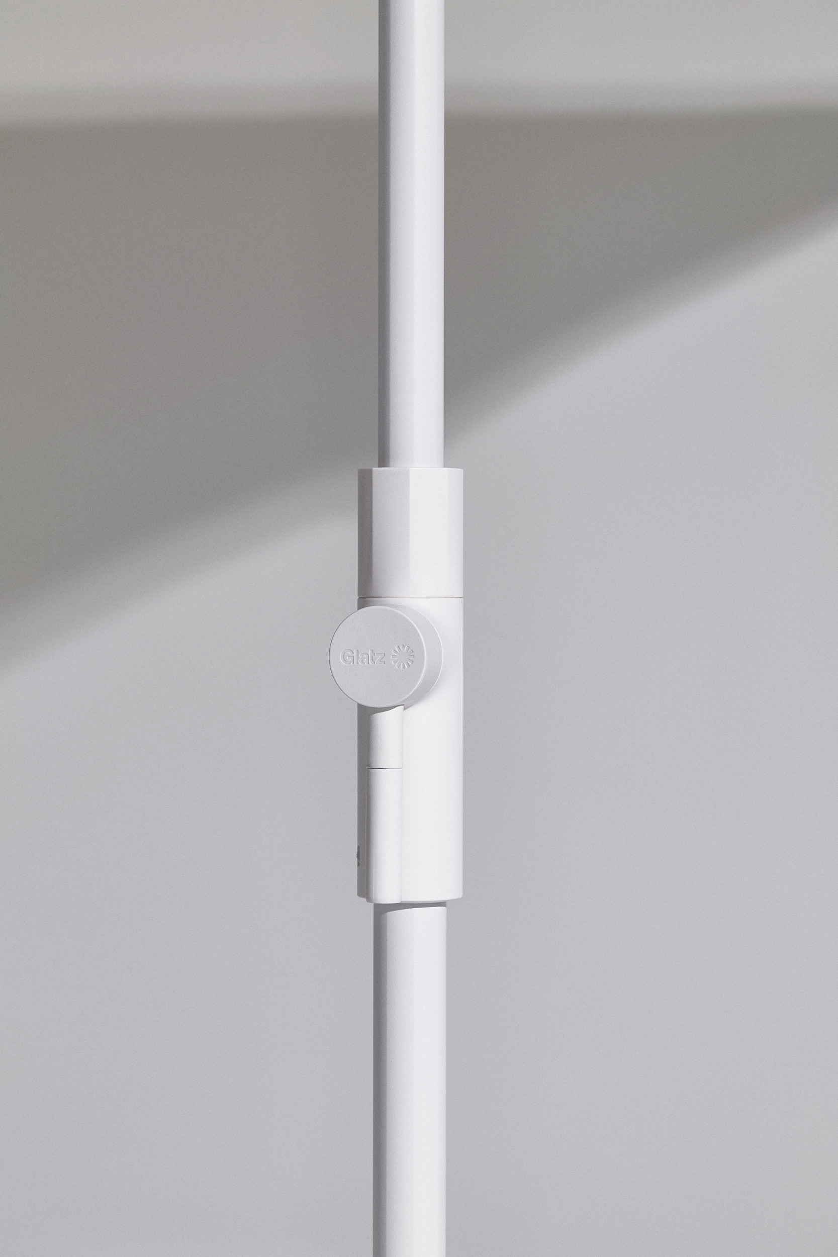 Twist mid-pole sunshade product design with simple and innovative mechanism.